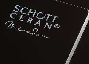 SCHOTT CERAN Miradur® logo on the corner of a black vitroceramic cooking surface-mobile