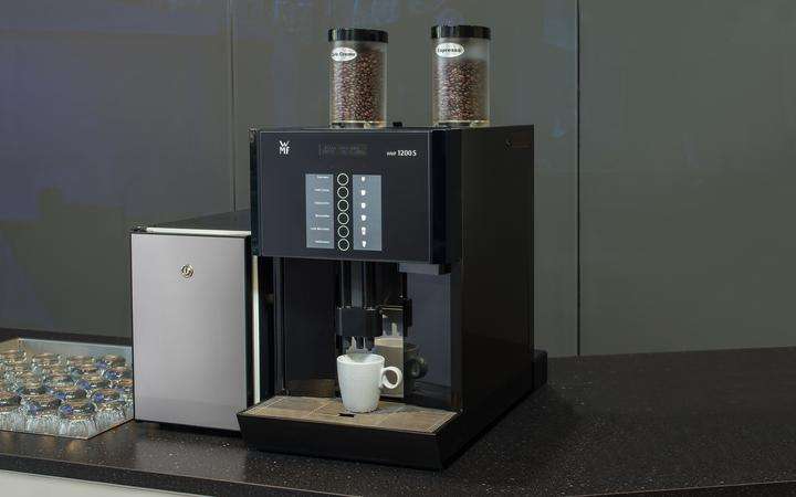 Commercial coffee machine with black glass control panel