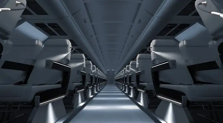 Aisle of an aircraft cabin with lighting from SCHOTT® HelioFlex Spot Lights