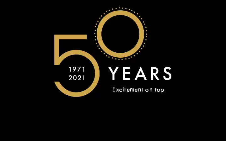 Typographic 50th-anniversary logo with brand slogan “Excitement on top.”