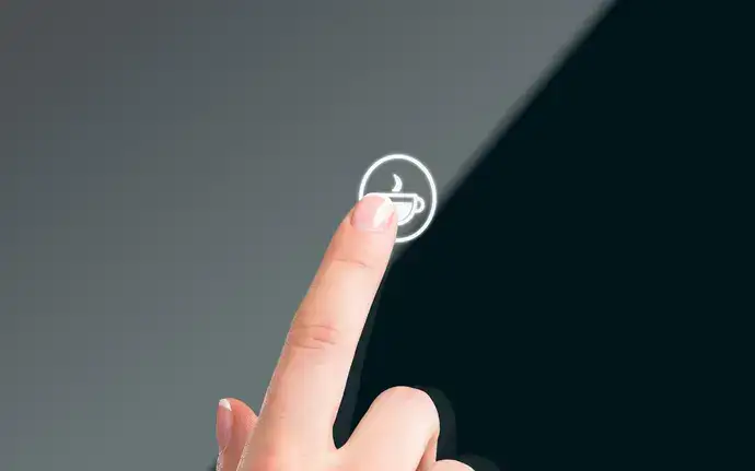 Finger touching a black panel touch control