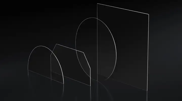 Four clear samples of SCHOTT Cut-to-Size Substrates in different shapes on a dark background