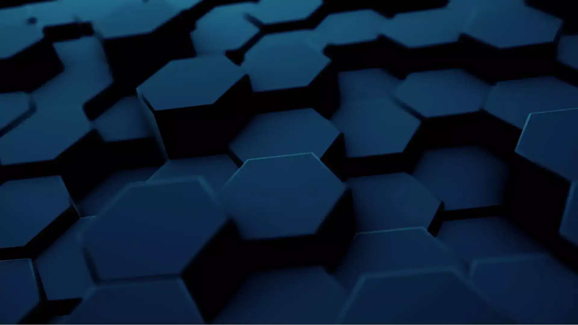 Serie de formas hexagonales negras impresas en un panel de cristal
