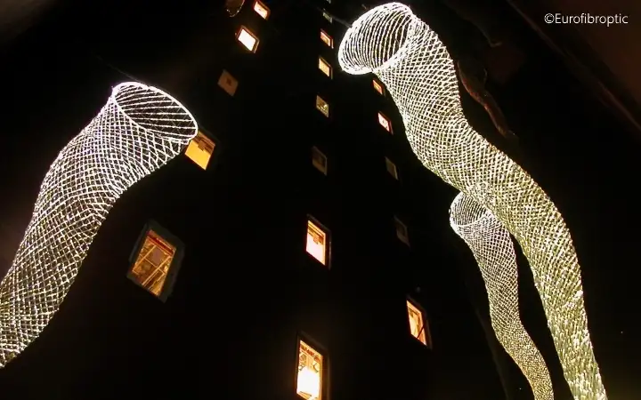 Outdoor light display using LED light sources and fiber optic light cables