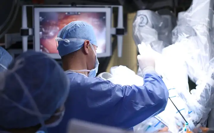 Surgeon performing a medical operation in a surgical theater