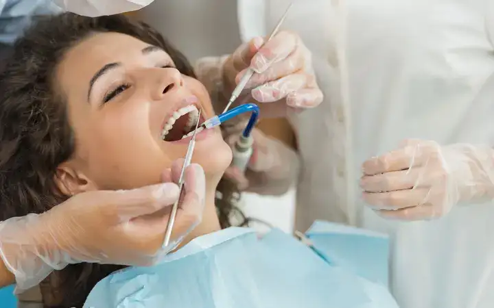 Female patient undergoing dental treatment