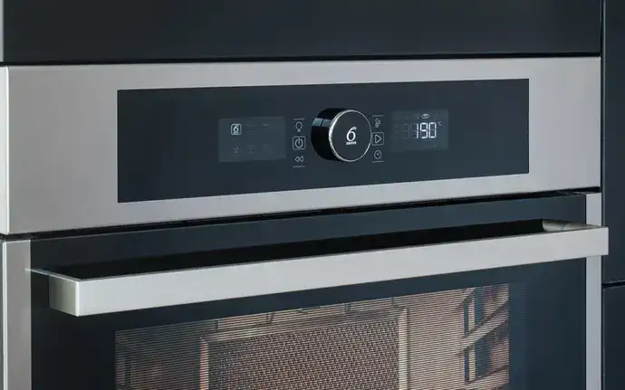 Glass front of a domestic oven with temperature control