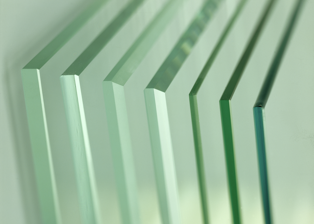  Stack of clear glass panels with different edge designs