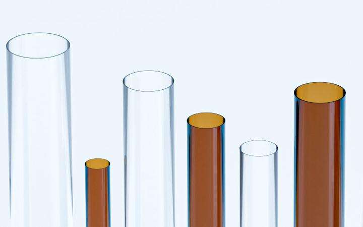 Several vertical samples of DUROBAX® clear and amber glass tubing