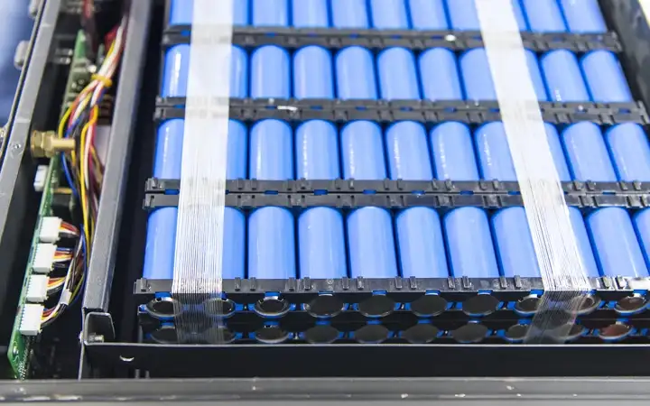 Blue batteries packed in a vertical stack