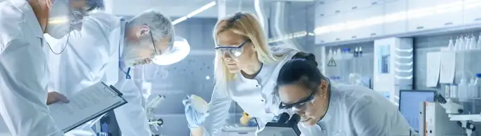 Scientists in a laboratory use Microscope, Test Tubes, Micropipette