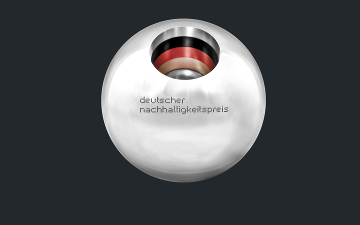 Close-up view of a silver ball with black-red-gold stripes in the middle and the text: German Sustainability Award