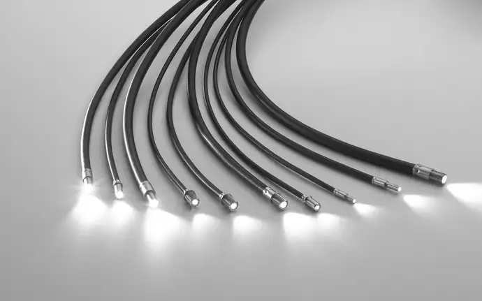 Several SCHOTT Fiber Optic Light Cables on a gray background