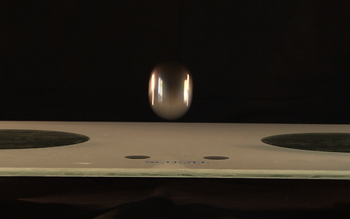 Ball drop test on a glass hob top to test its mechanical impact resistance