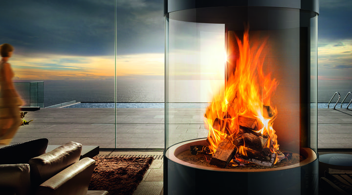 Burning fire in an outdoor log burner encased in glass