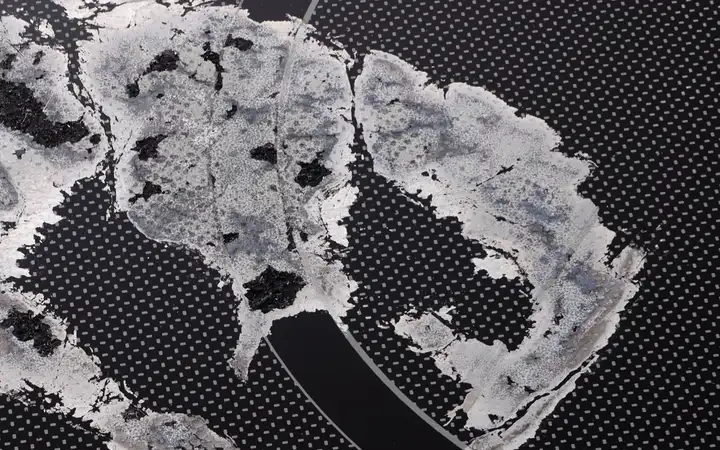 Aluminum foil burned onto a glass-ceramic cooking surface