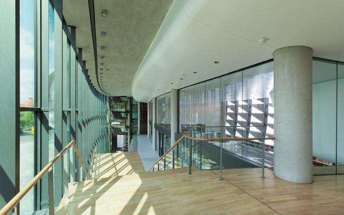 Internal staircase of an office building with glass walls and partitions