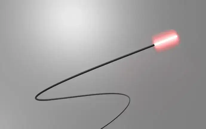 A single SCHOTT® Luminous Cylindrical Diffuser emitting red light