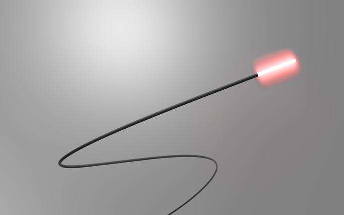 A single SCHOTT® Luminous Cylindrical Diffuser emitting red light