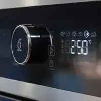Glass control panel of a domestic oven with temperature control