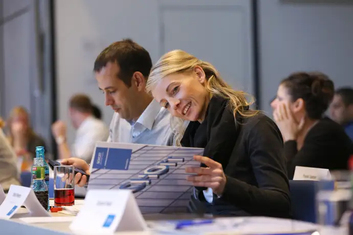 Male and female at an industry conference