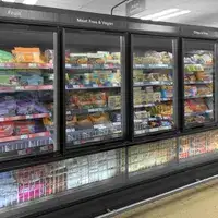 A row of supermarket freezers featuring SCHOTT Termofrost® Twinline glass door systems